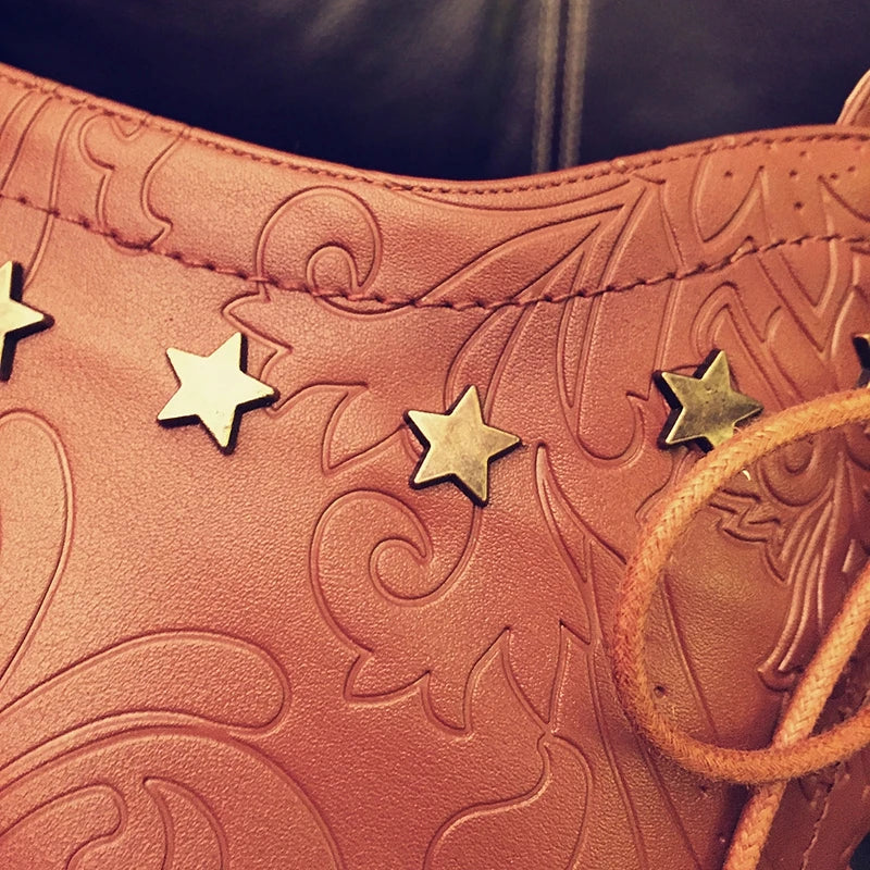 Women's leather embossed pattern cowhide high-heeled high heels with large straps and knee rivets
